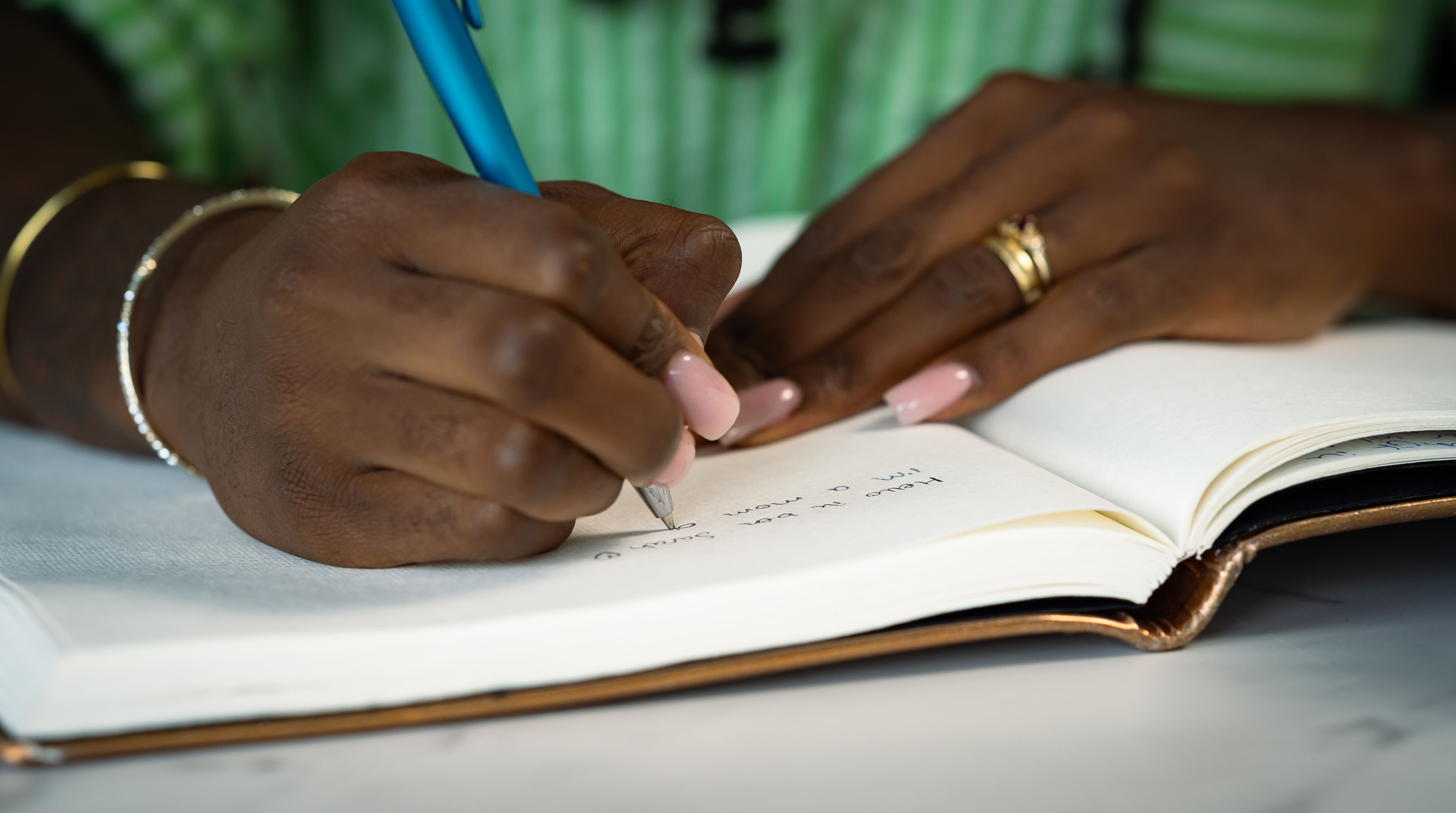 Writing in a journal as part of the 5-Minute Reset practice